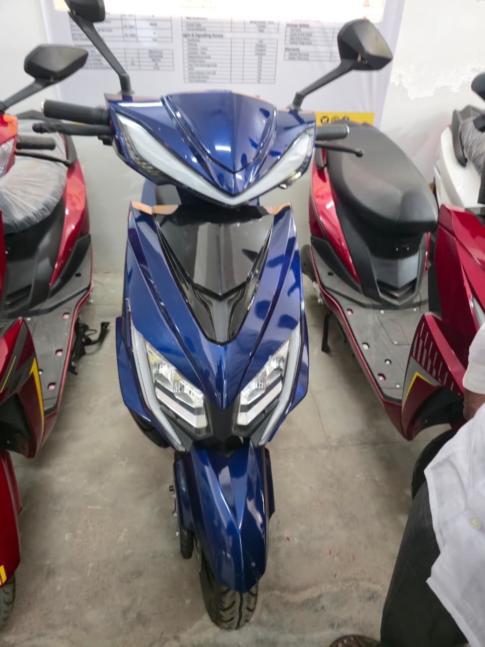 Blue electric scooter with dual LED headlights